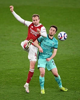 Images Dated 3rd April 2021: Holding His Ground: Rob's Pressure-Clearing Moment in Arsenal vs. Liverpool's Premier League Battle