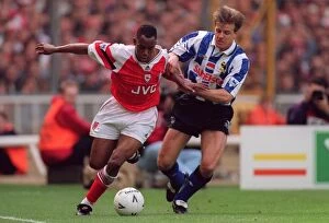 Wright Ian Collection: Ian Wright (Arsenal) and Roland Nilsson (Sheffield Wednesday)