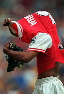 Ian Wright (Arsenal) takes off his shirt