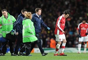 Images Dated 31st March 2010: Injured Arsenal captain Cesc Fabregas limps off the pitch. Arsenal 2: 2 Barcelona