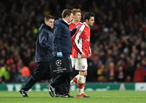 Arsenal V Barcelona 2009-10 Prints: Injured Arsenal captain Cesc Fabregas limps off the pitch. Arsenal 2: 2 Barcelona