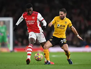Arsenal V Wolverhampton Wanderers 2021-22 Prints: Intense Battle: Arsenal vs. Wolverhampton Wanderers at Emirates Stadium
