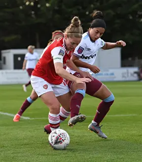 Intense Battle: Arsenal Women vs West Ham United at Meadow Park