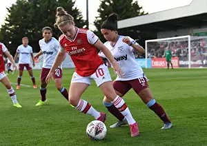 Intense Battle: Arsenal Women vs West Ham United at Meadow Park