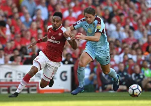 Intense Battle: Aubameyang vs. Tarkowski at the Emirates