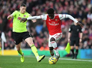 Intense Battle: Bukayo Saka vs. John Lundstram - Arsenal's Clash Against Sheffield United