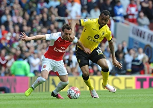 Arsenal V Aston Villa 2015-16 Prints: Intense Battle: Cazorla Holds Off Ayew in Arsenal vs. Aston Villa Clash