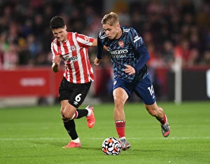 Images Dated 14th August 2021: Intense Battle: Emile Smith Rowe vs. Christian Norgaard - Brentford vs