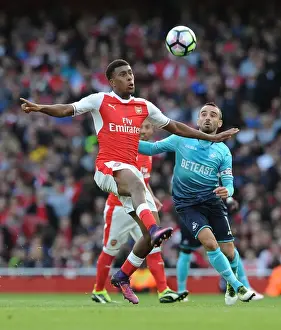 Intense Battle: Iwobi vs Britton in Arsenal vs Swansea Premier League Clash