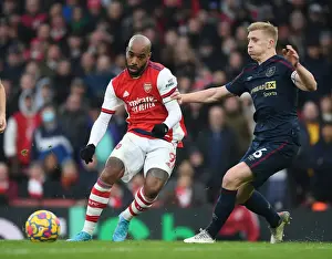 Intense Battle: Lacazette vs. Tarkowski in Arsenal's Premier League Clash against Burnley