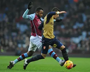 Aston Villa V Arsenal 2015-16 Prints: Intense Battle: Mesut Ozil vs Leandro Bacuna at Aston Villa vs Arsenal (Premier League 2015-16)