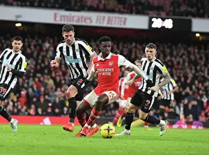 Arsenal V Newcastle United 2022-23 Prints: Intense Battle: Nketiah vs. Schar in Arsenal's Premier League Clash