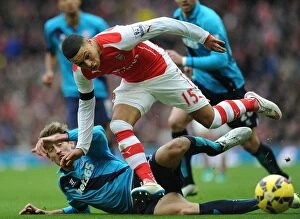 Images Dated 11th January 2015: Intense Battle: Oxlade-Chamberlain vs Crouch - Arsenal vs Stoke City (2014-15)