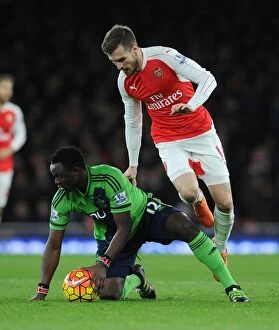Arsenal v Southampton 2015-16 Collection: Intense Battle: Ramsey vs. Wanyama - Arsenal's Midfield Tussle against Southampton