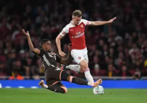 Arsenal V Brentford - Carabao Cup 2018-19 Prints: Intense Battle: Rob Holding vs Ezri Konsa in the Carabao Cup Clash
