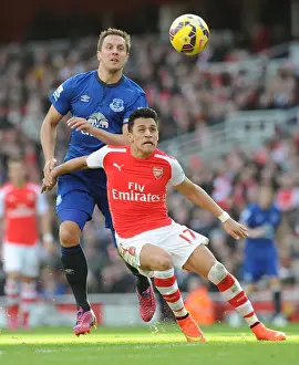 Arsenal Everton 2014-15 Prints: Intense Battle: Sanchez Holds Off Jagielka in Arsenal vs. Everton Clash
