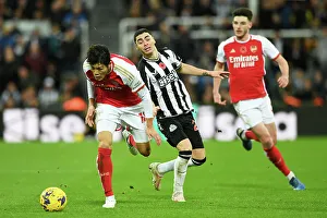 Newcastle United V Arsenal 2023-24 Prints: Intense Battle: Tomiyasu vs Almiron at St