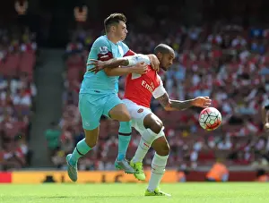 Arsenal V West Ham United 2015-16 Prints: Intense Battle: Walcott vs. Cresswell - Arsenal vs. West Ham Football Rivalry