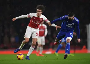 Arsenal V Cardiff City 2018-19 Prints: Intense Clash: Guendouzi vs. Paterson in Arsenal's Premier League Battle
