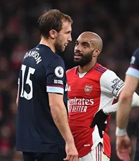 Arsenal V West Ham United 2021-22 Prints: Intense Clash: Lacazette vs. Dawson in Arsenal's Battle Against West Ham United
