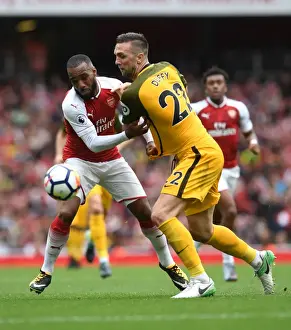 Arsenal V Brighton And Hove Albion 2017-18 Prints: Intense Clash: Lacazette vs. Duffy in Premier League Showdown