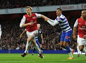 Arsenal V Queens Park Rangers 2011-12 Prints: Intense Clash: Mertesacker vs. Bothroyd at Arsenal vs. QPR