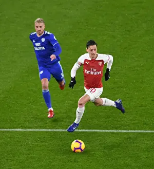 Arsenal V Cardiff City 2018-19 Prints: Intense Clash: Mesut Ozil vs. Joe Bennett in Arsenal's Premier League Battle