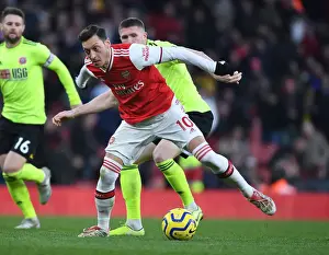 Arsenal V Sheffield United 2019-20 Prints: Intense Clash: Mesut Ozil vs. John Lundstram in Premier League Showdown at Arsenal's Emirates Stadium