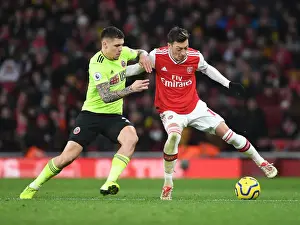 Arsenal V Sheffield United 2019-20 Prints: Intense Clash: Ozil vs. Baldock in Arsenal's Premier League Battle against Sheffield United