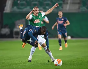 Rapid Vienna V Arsenal 2020-21 Prints: Intense Clash: Partey Fouls and Dramatic Moments - Rapid Vienna vs