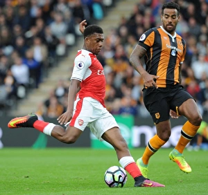 Intense Face-Off: Alex Iwobi vs. Tom Huddlestone in Premier League Battle