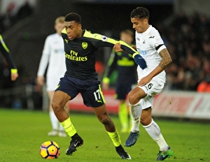 Intense Face-Off: Alex Iwobi vs. Kyle Naughton in Swansea vs. Arsenal Premier League Clash