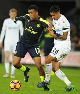 Swansea City V Arsenal - 2016-17 Prints: Intense Face-Off: Alex Iwobi vs Kyle Naughton - Swansea vs Arsenal Premier League Clash
