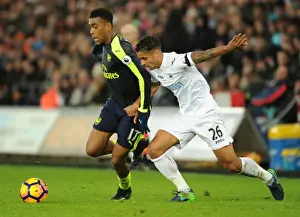 Swansea City V Arsenal - 2016-17 Prints: Intense Face-off: Alex Iwobi vs Kyle Naughton in Swansea vs Arsenal Premier League Clash
