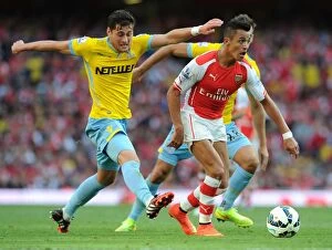 Images Dated 16th August 2014: Intense Face-Off: Alexis Sanchez vs. Joel Ward in Premier League Battle