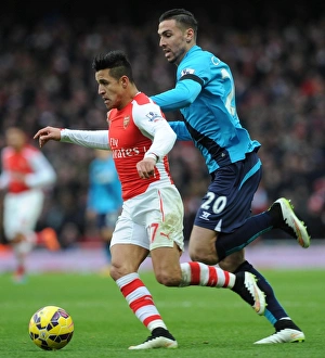 Arsenal V Stoke City 2014-15 Prints: Intense Face-Off: Alexis Sanchez vs