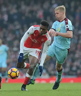Arsenal V Burnley 2016-17 Prints: Intense Face-Off: Iwobi vs Mee - Arsenal's Battle Against Burnley