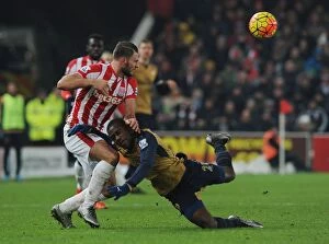 Stoke City v Arsenal 2015-16 Collection: Intense Face-off: Joel Campbell vs. Erik Pieters in Arsenal's Premier League Battle