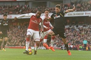 Arsenal V Swansea City 2017-18 Prints: Intense Face-Off: Lacazette vs. Fernandez in Premier League Battle