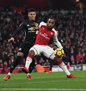 Arsenal V Manchester United 2017-18 Prints: Intense Face-Off: Lacazette vs. Rojo - Arsenal vs. Manchester United Premier League Clash