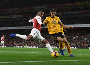 Intense Face-Off: Lacazette vs. Coady in Arsenal's Premier League Battle