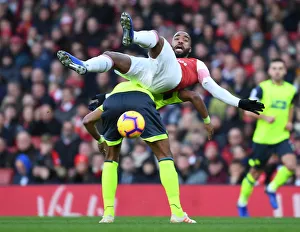 Arsenal V Huddersfield Town - 2018-19 Prints: Intense Face-off: Lacazette vs. Jorgensen in Arsenal's Premier League Battle