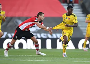 Southampton V Arsenal 2019-20 Prints: Intense Face-Off: Nketiah vs Bednarek in Southampton's Premier League Showdown