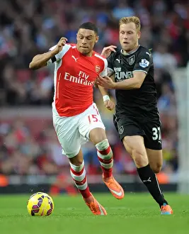 Arsenal V Burnley 2014/15 Prints: Intense Face-Off: Oxlade-Chamberlain vs Arfield in Arsenal's Premier League Clash