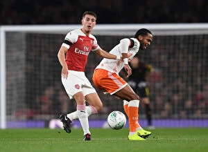Images Dated 31st October 2018: Intense Face-off: Pleguezuelo vs. Delfouneso in Arsenal's Carabao Cup Showdown