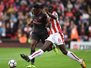 Stoke City V Arsenal 2017-18 Prints: Intense Face-Off: Welbeck vs Zouma