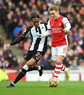 Intense Midfield Rivalry: Odegaard vs. Willock at Emirates Stadium - Arsenal vs. Newcastle United (2021-22)
