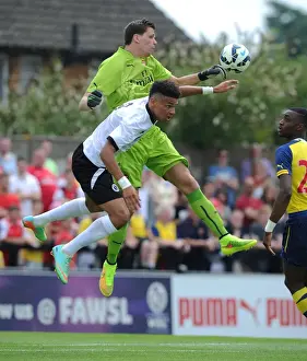 Boreham Wood V Arsenal Prints: Intense Moment: Szczesny vs. Angol in Arsenal's Pre-Season Clash