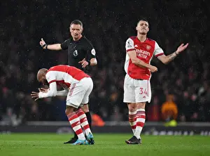 Intense Rivalry: Arsenal's Lacazette and Xhaka's Reaction to Referee Decision Amidst Arsenal vs. Liverpool Controversy (2021-22)