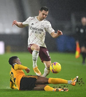 Wolverhampton Wanderers v Arsenal 2020-21 Collection: Intense Rivalry: Cedric Soares vs Nelson Semedo Battle at Wolverhampton Wanderers vs Arsenal